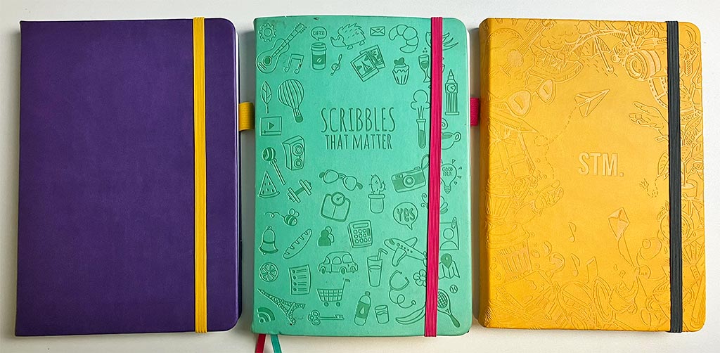 A5 notitieboeken van Scribbles That Matter: Pro aubergine, vintage Iconic mint en Iconic mustard